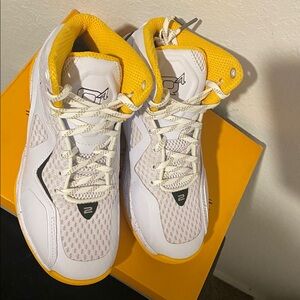 White and Yellow Athletic Shoes